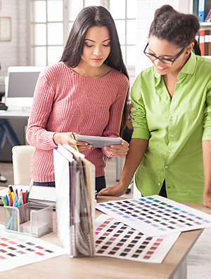 Two women working in a modern office.