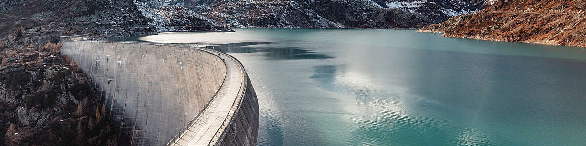 Emosson hydroelectric dam and lake surrounded by rocky landscape, in Switzerland.